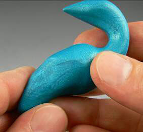 Blue clay being shaped